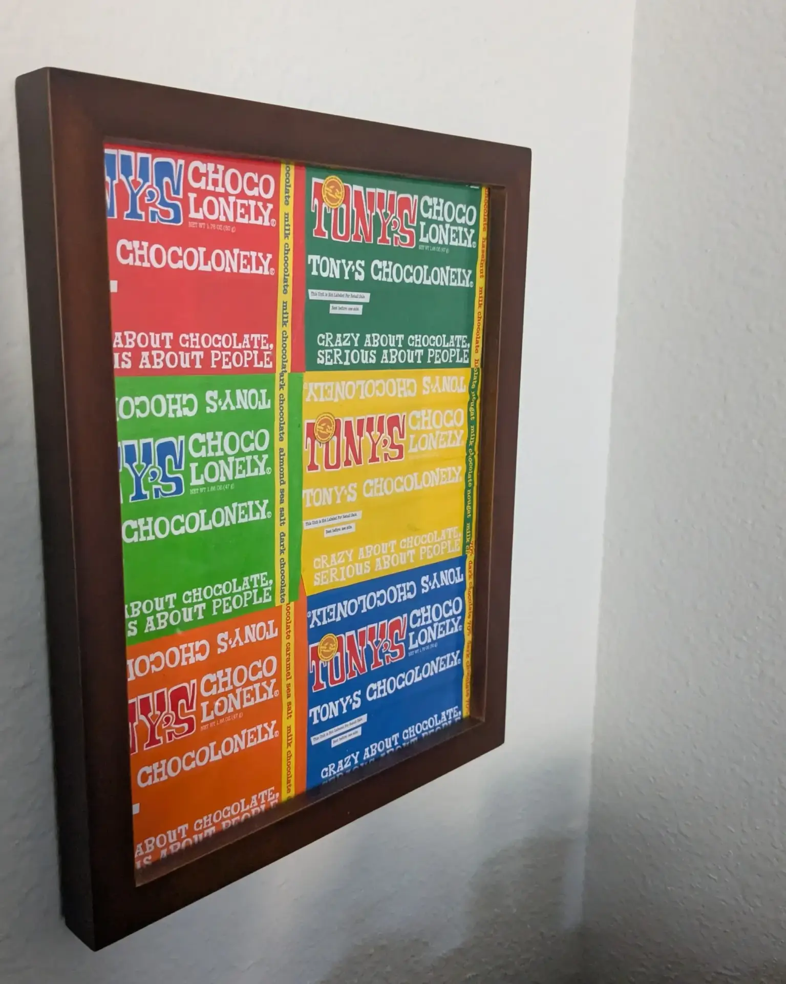 Framed artwork made with Tony's Chocolonely chocolate wrappers.